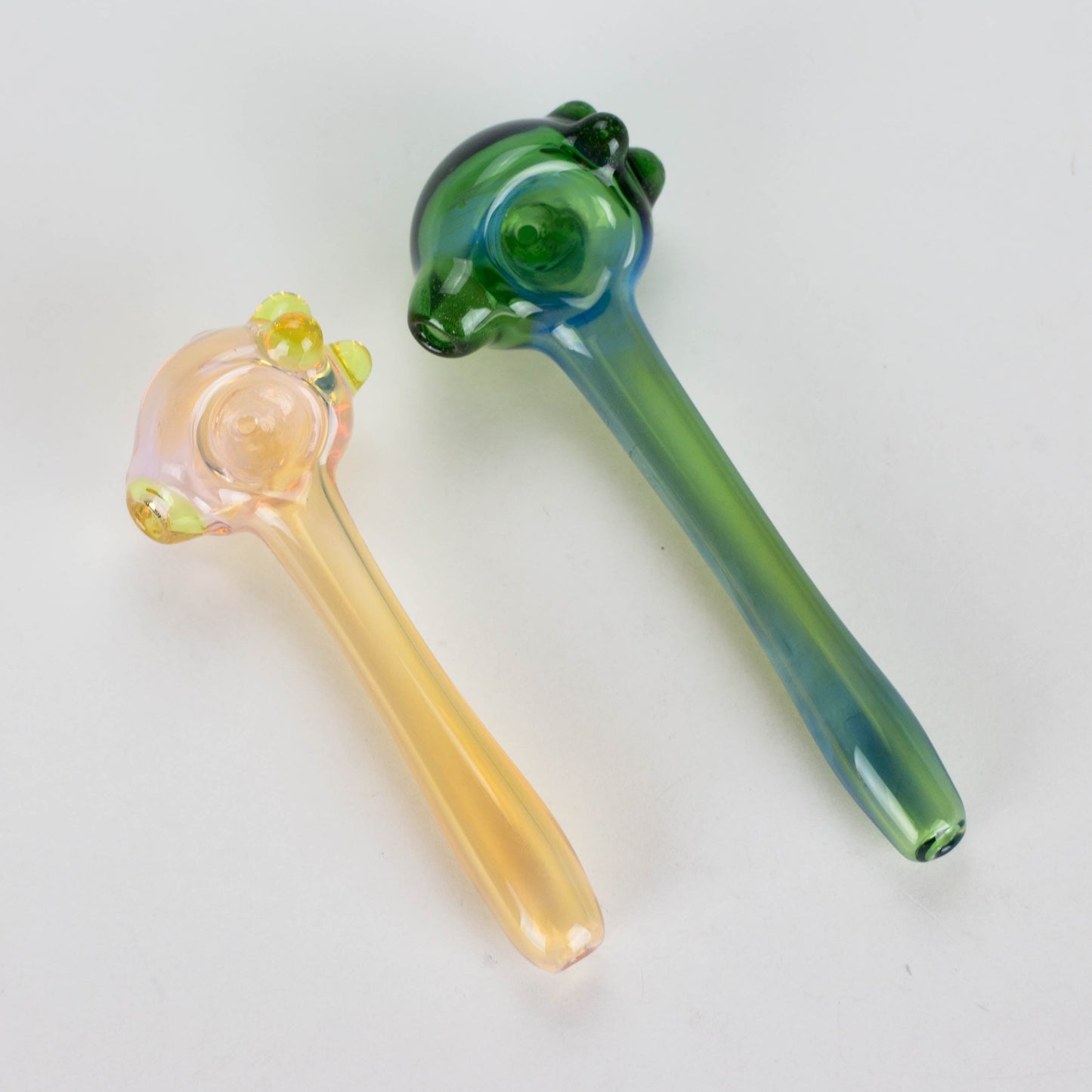 two small glass smoking pipes