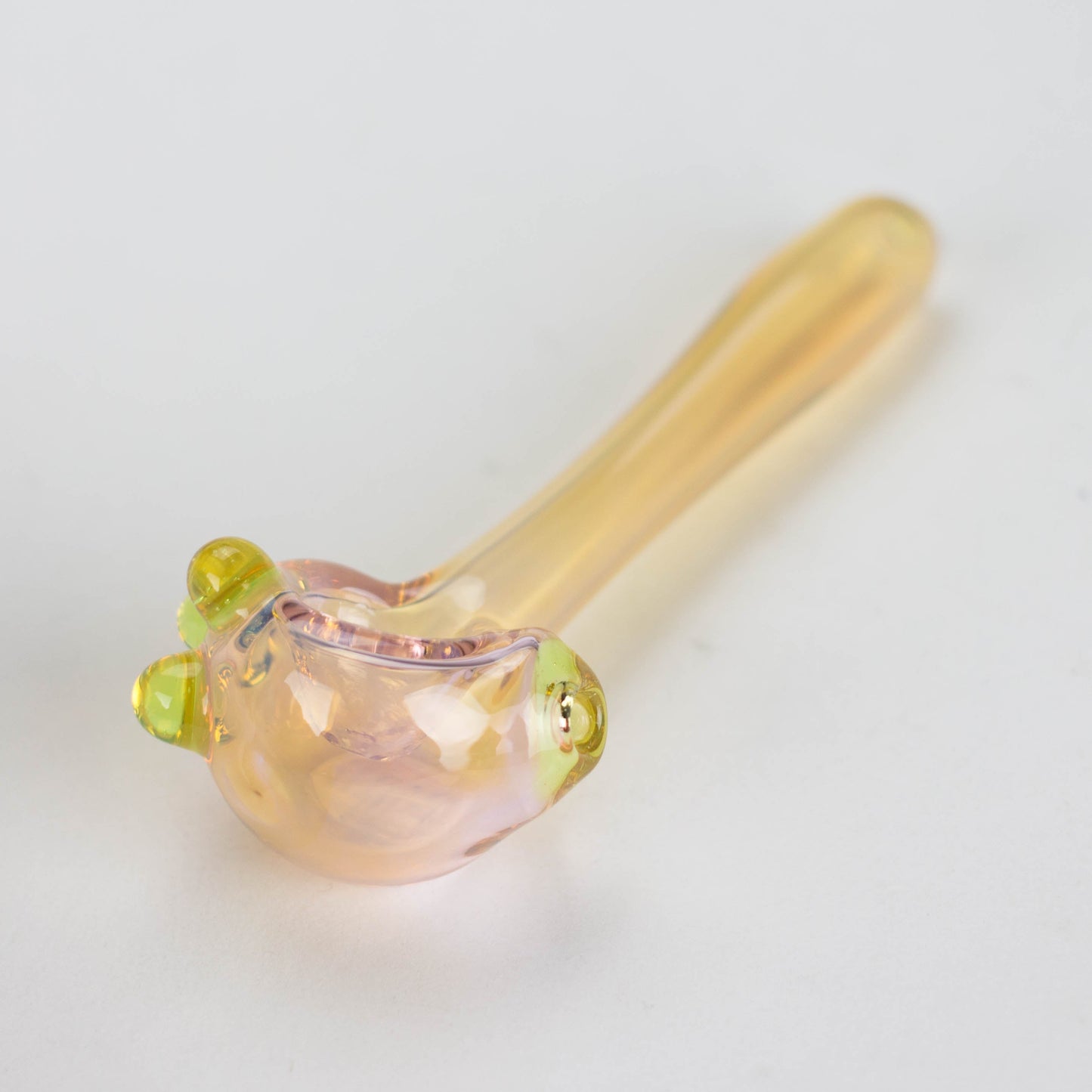 a translucent yellowish smoking pipe, front angle