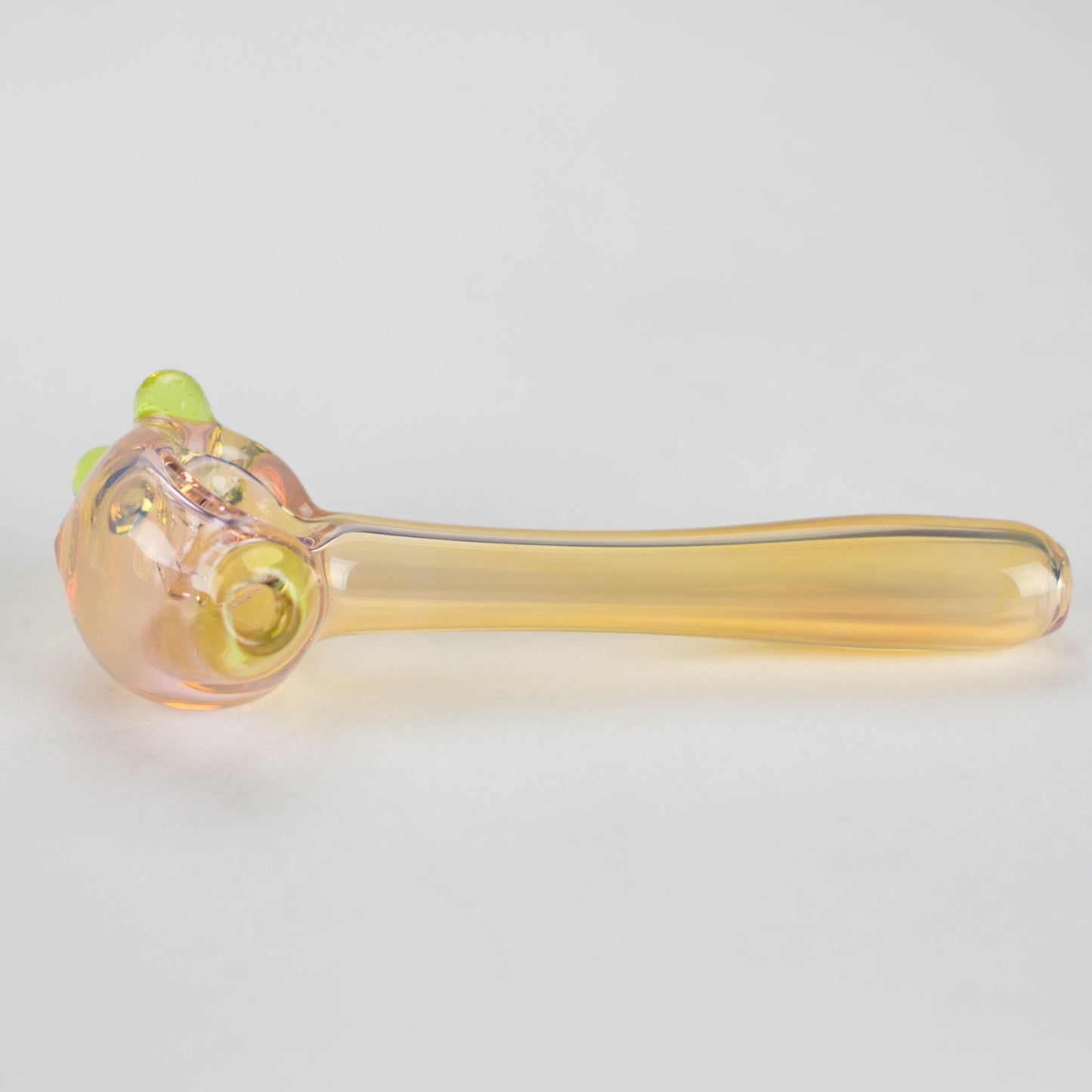 a translucent yellowish smoking pipe side angle