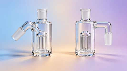 Two clear glass ash catchers with angled and right-angle connectors on a soft blue, sand and lilac background